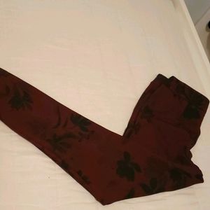 Red and black foliage patterned dress pants